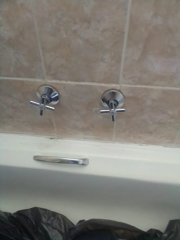Bathroom tap and fitting replacement with bath taps and tiled wall in Sandton