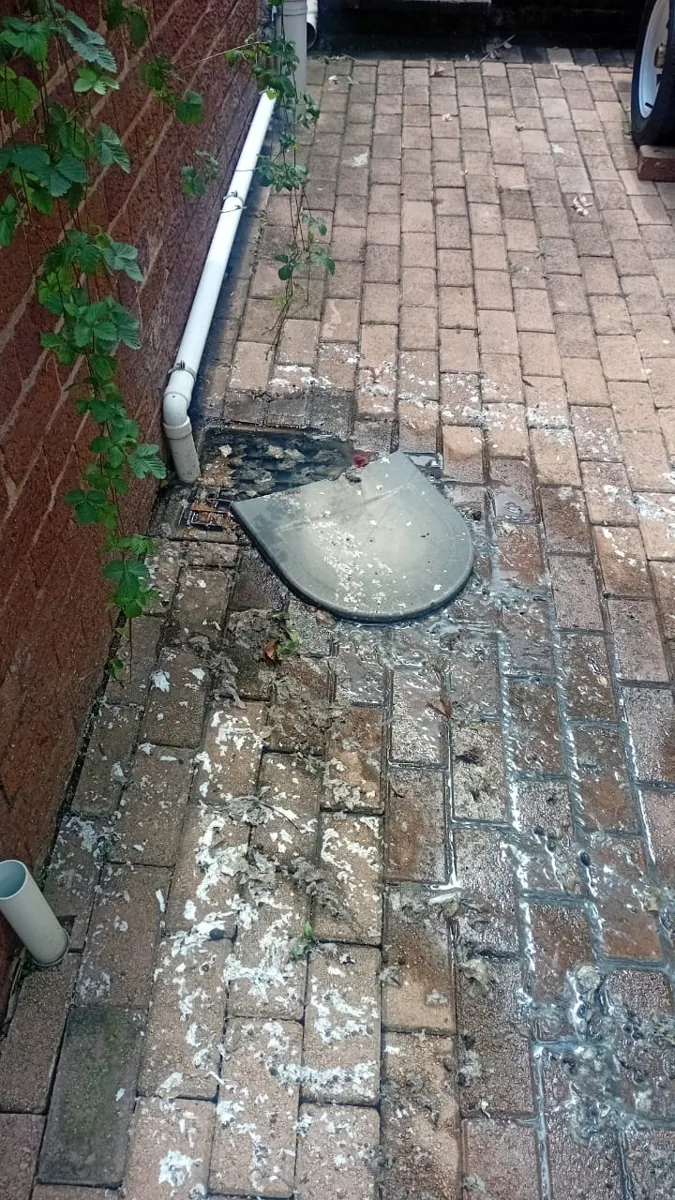 Outside gully overflow and wastewater on paving in Sandton