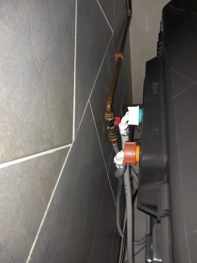 Dishwasher cold-water feed and isolation valve connection in a Sandton kitchen
