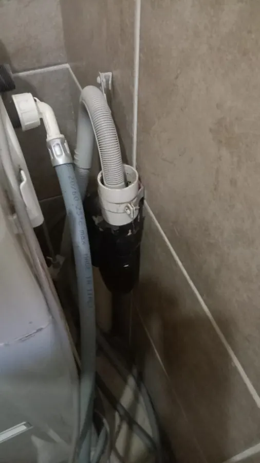 Dishwasher waste hose routed into standpipe for Sandton appliance drainage